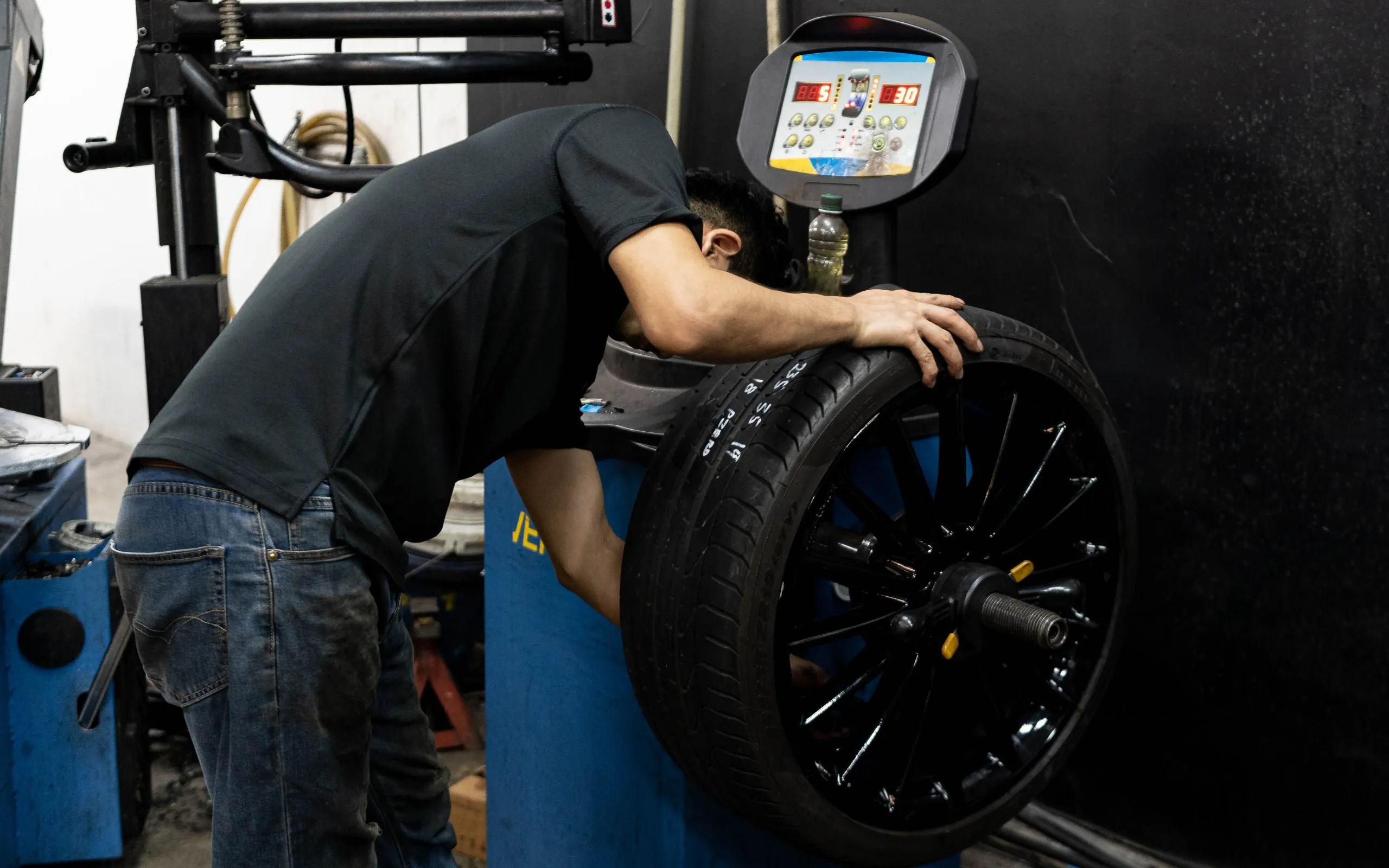 Tyre balancing machine at work inside Mrrjestic Tyres