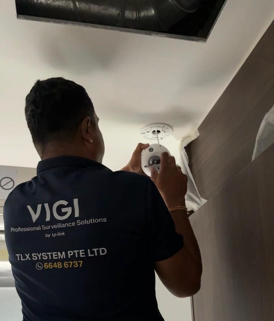 TLX System technician installing a ceiling CCTV camera