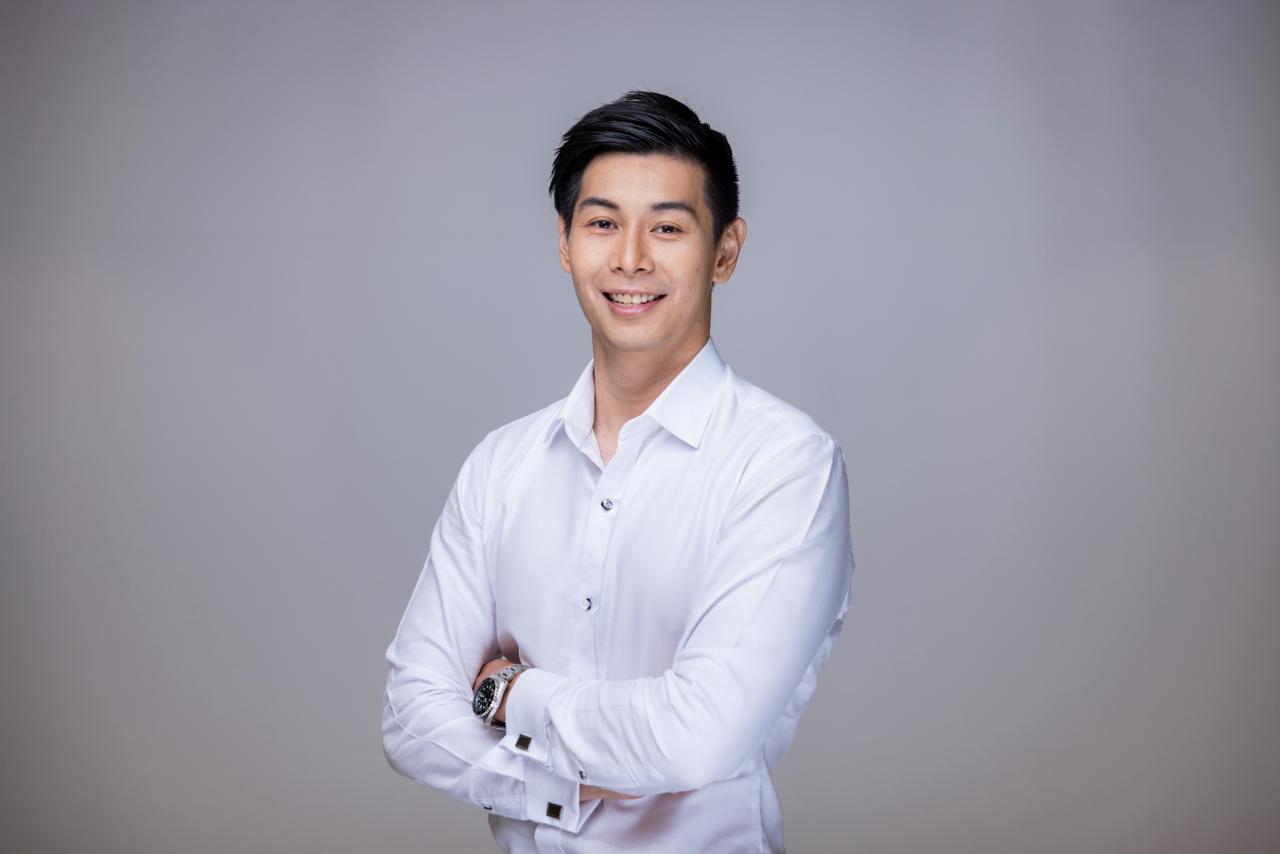 Yong Jian Ng in a studio portrait wearing a white shirt